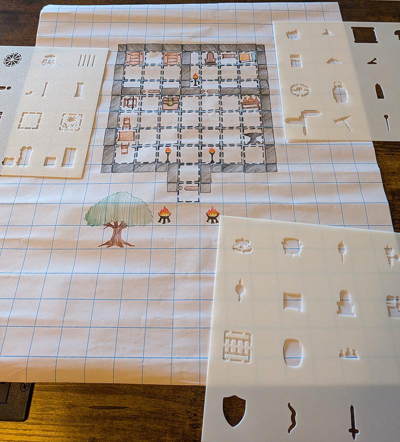 Hand pressing stencil on parchment